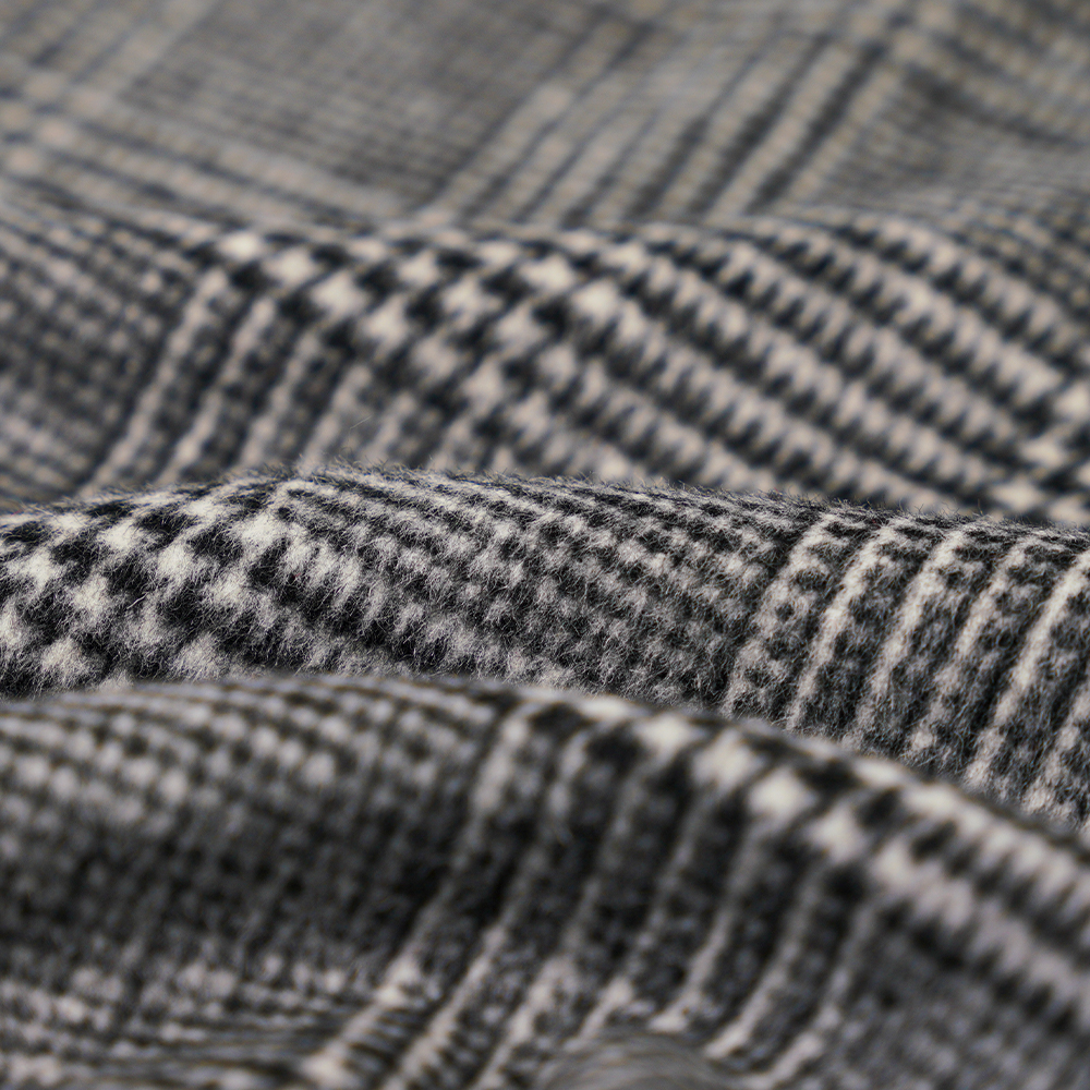 50% gyapjú, 40% poliészter, 10% egyéb szál, 560 G/M, fekete + világosszürke, kockás, egyoldali bevonó gyapjúszövet, ML-1010015